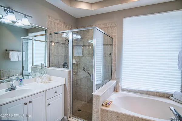 a bathroom with a bathtub and a sink
