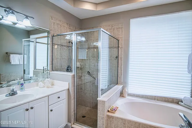 a bathroom with a bathtub and a sink
