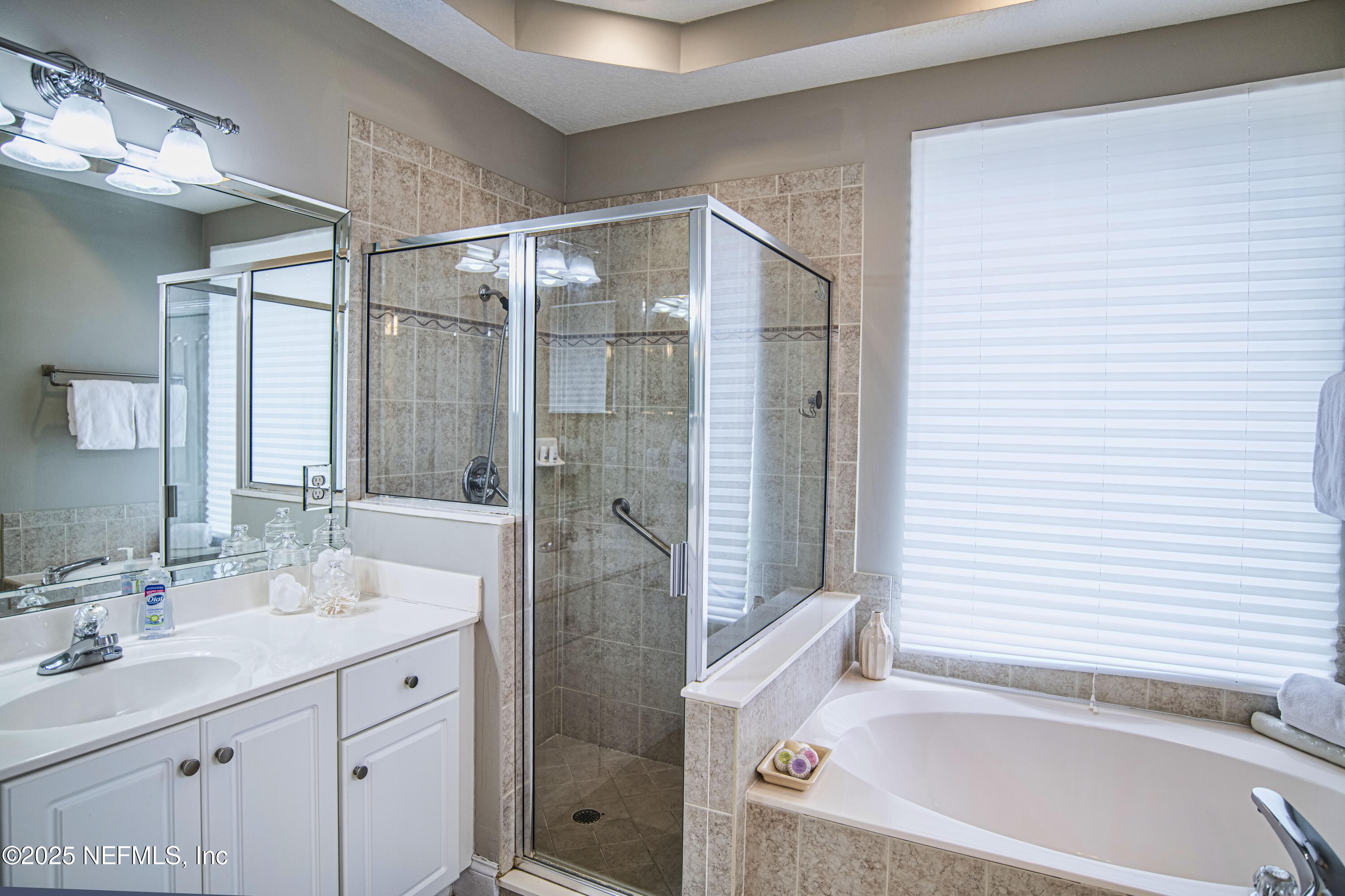 341 Island Green Drive St. Augustine, FL 32092 - Photo 7 of 49 a bathroom with a bathtub and a sink