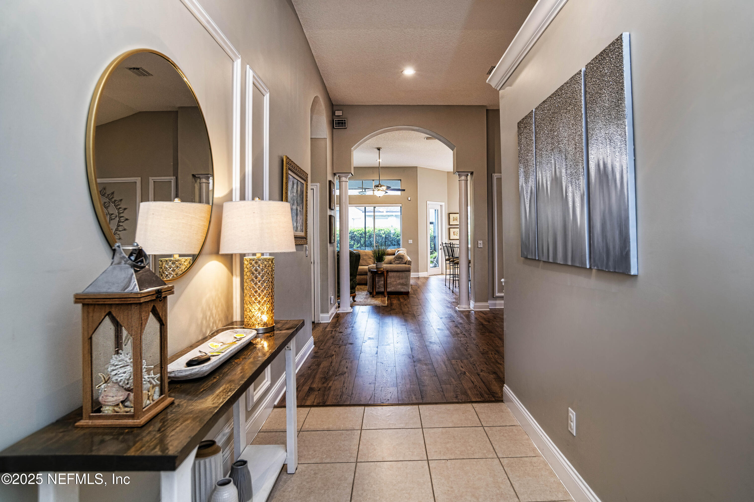 341 Island Green Drive St. Augustine, FL 32092 - Photo 10 of 49 a view of a livingroom with wooden floor and furniture