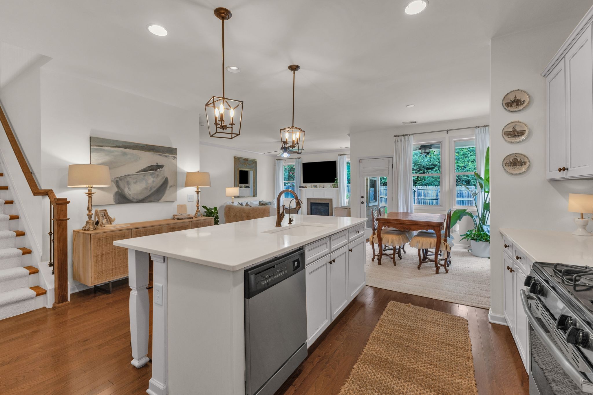 2020 Austin Drive Spring Hill, TN 37174 - Photo 16 of 40 a kitchen with stainless steel appliances granite countertop a stove oven a sink dishwasher and a dining table with wooden floor