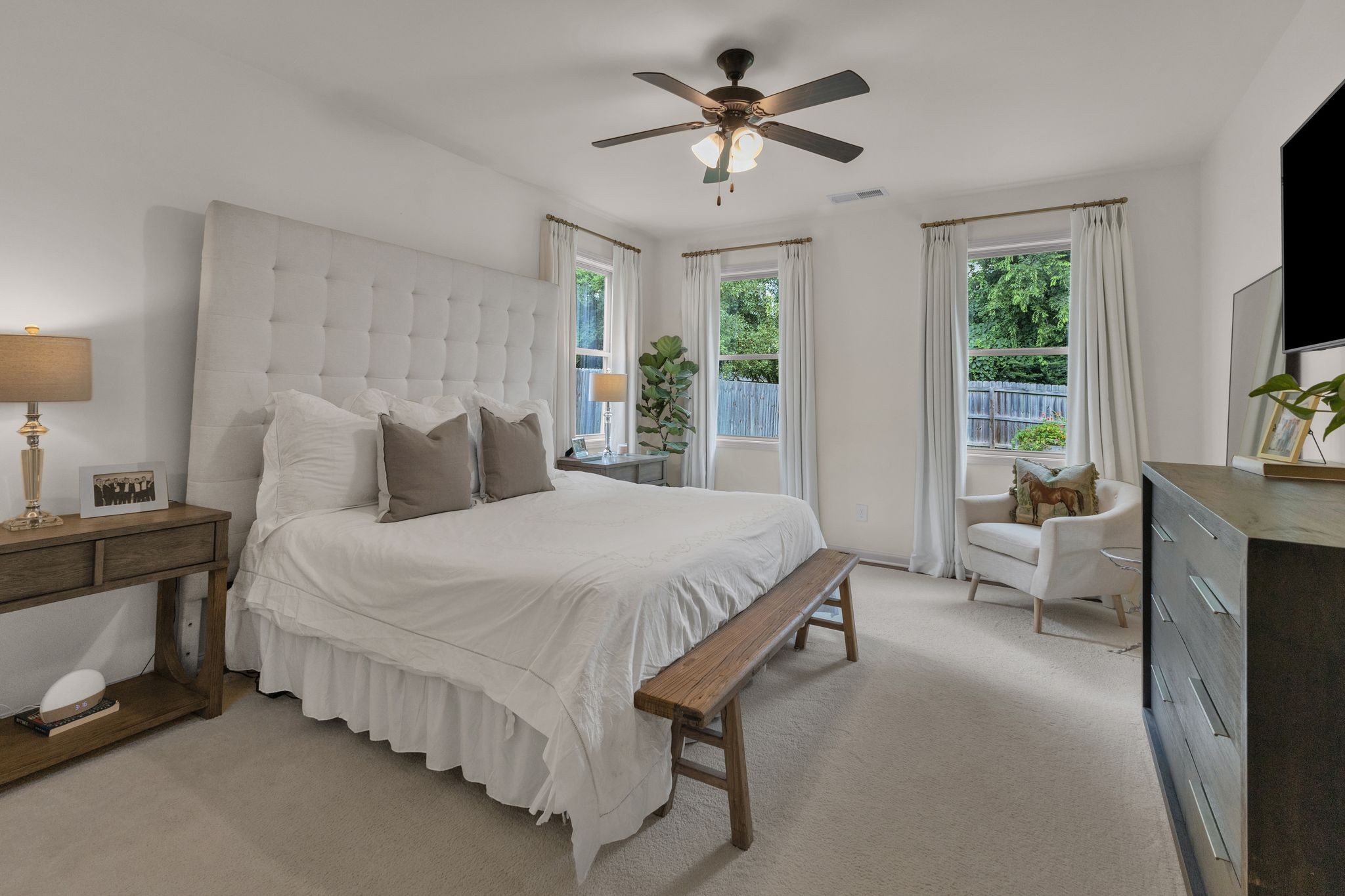 2020 Austin Drive Spring Hill, TN 37174 - Photo 17 of 40 a spacious bedroom with a bed couch and a flat tv screen