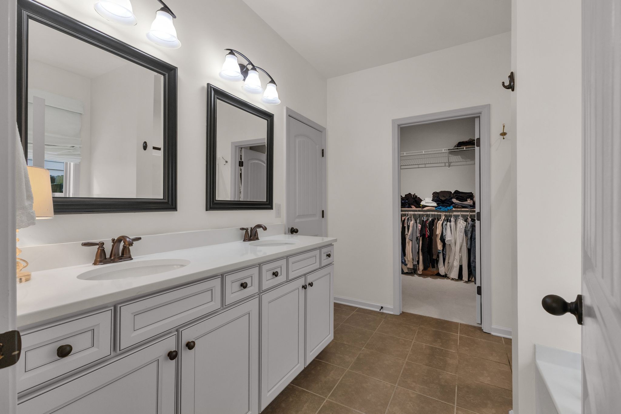 2020 Austin Drive Spring Hill, TN 37174 - Photo 19 of 40 a bathroom with a double vanity sink and mirror