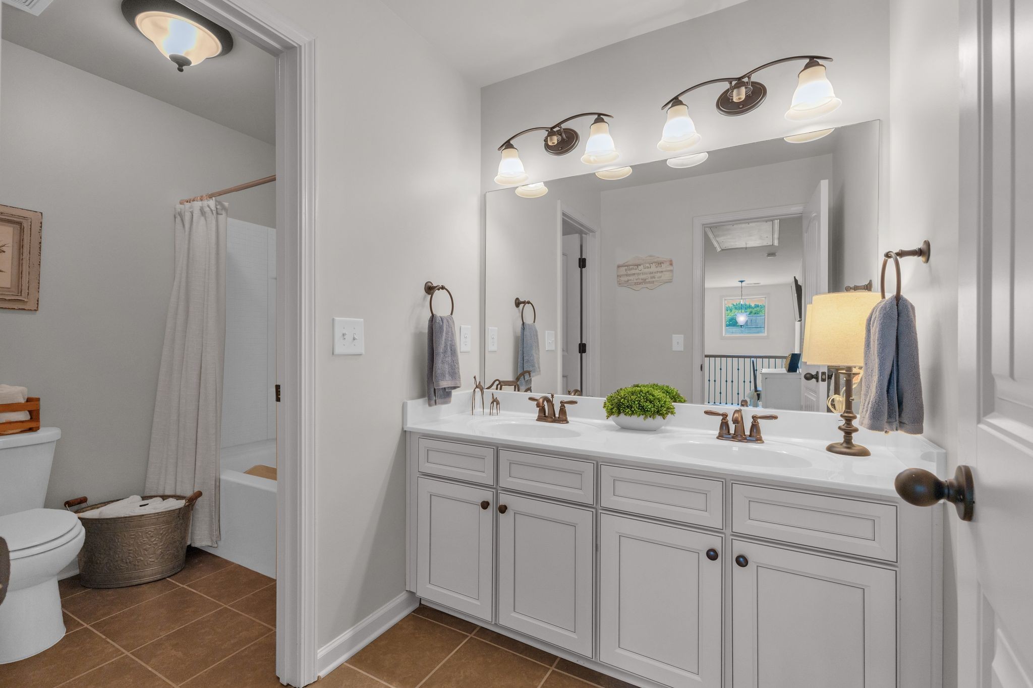 2020 Austin Drive Spring Hill, TN 37174 - Photo 37 of 40 a bathroom with a double vanity sink and a mirror