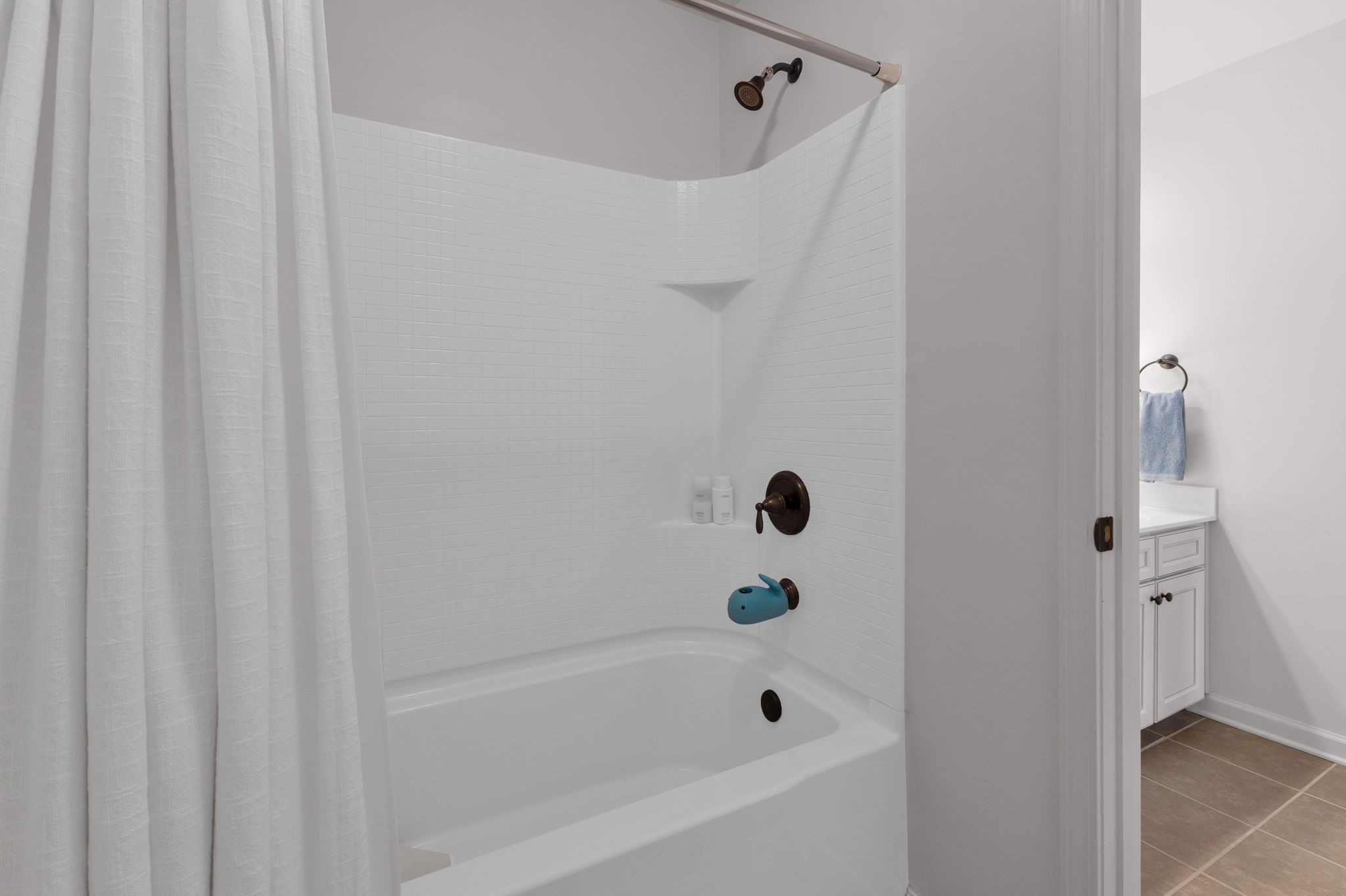 2020 Austin Drive Spring Hill, TN 37174 - Photo 38 of 40 a bathroom with a tub and shower