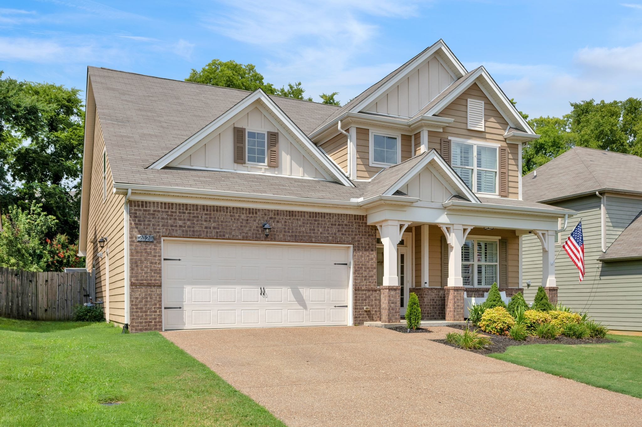 2020 Austin Drive Spring Hill, TN 37174 - Photo 4 of 40 a front view of a house with a garden and plants