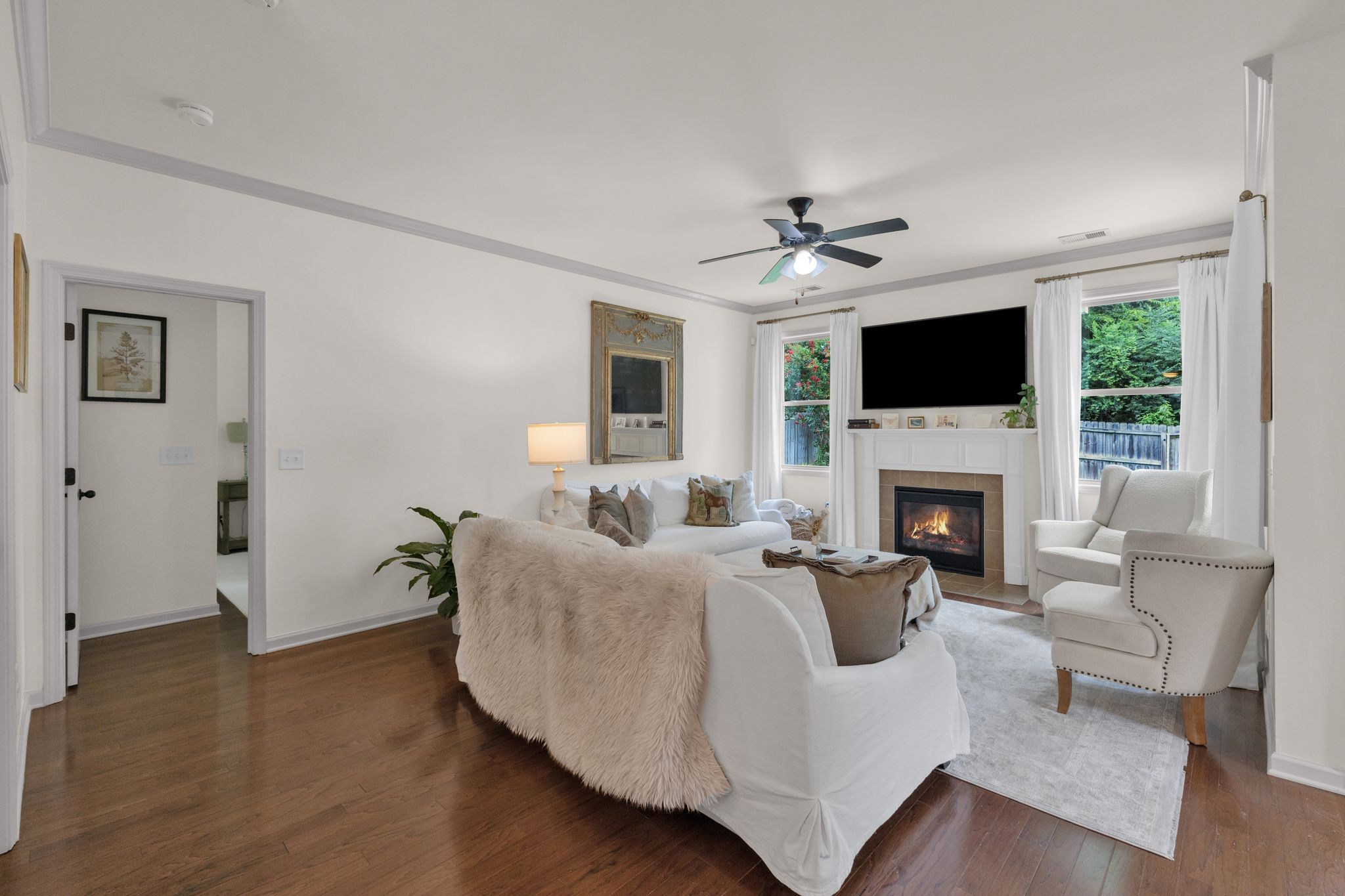 2020 Austin Drive Spring Hill, TN 37174 - Photo 10 of 40 a living room with furniture a fireplace and a flat screen tv