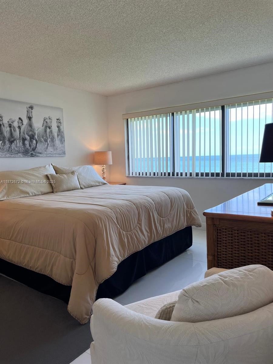 4200 North Hwy A1A, Unit 614 Fort Pierce, FL 34949 - Photo 13 of 63 a bedroom with a bed and window