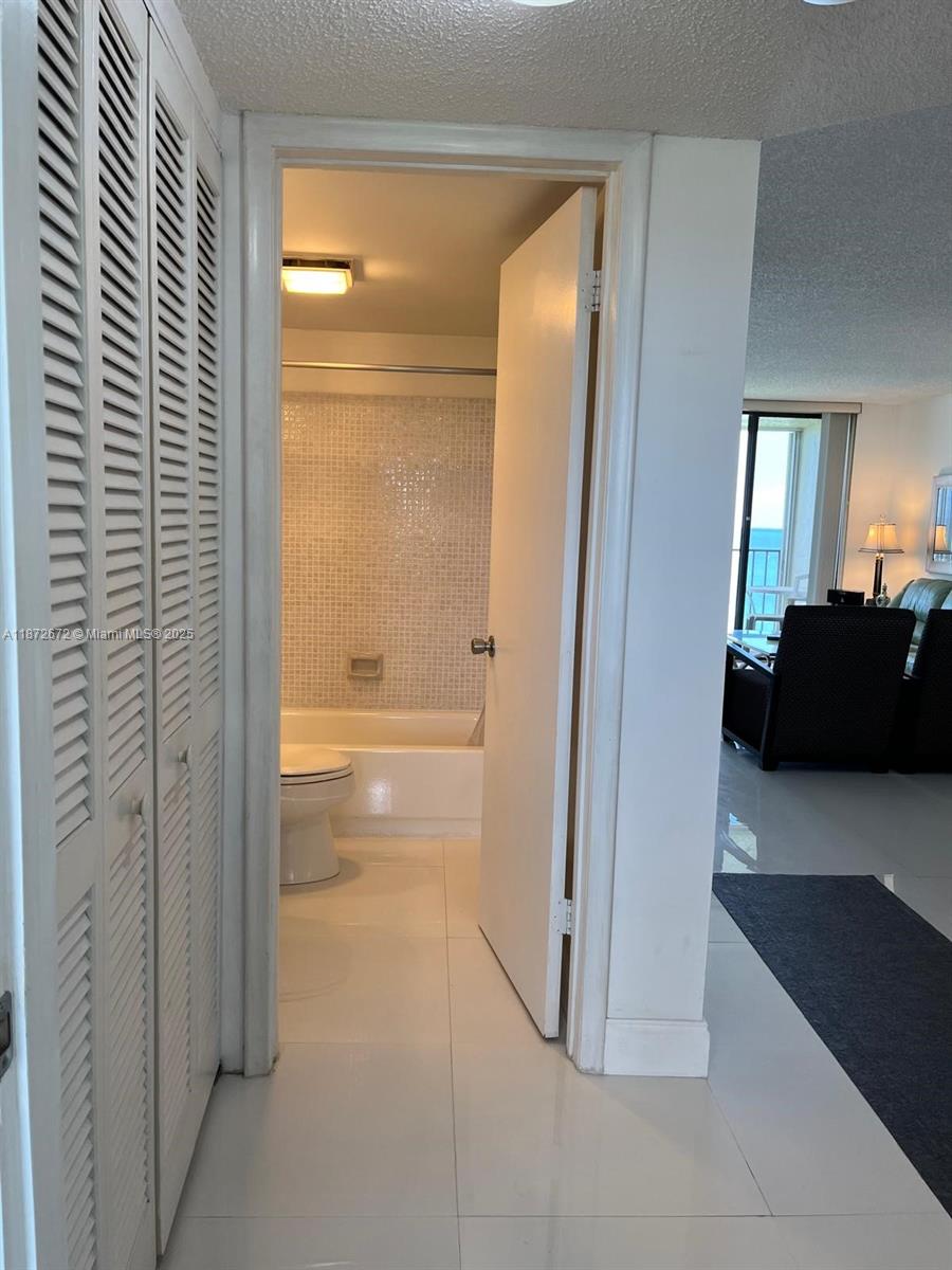 4200 North Hwy A1A, Unit 614 Fort Pierce, FL 34949 - Photo 15 of 63 a view of a bathroom with a glass door