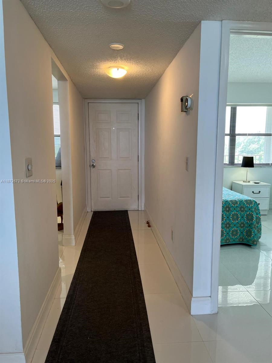 4200 North Hwy A1A, Unit 614 Fort Pierce, FL 34949 - Photo 19 of 63 a view of a bathroom with a sink and a mirror