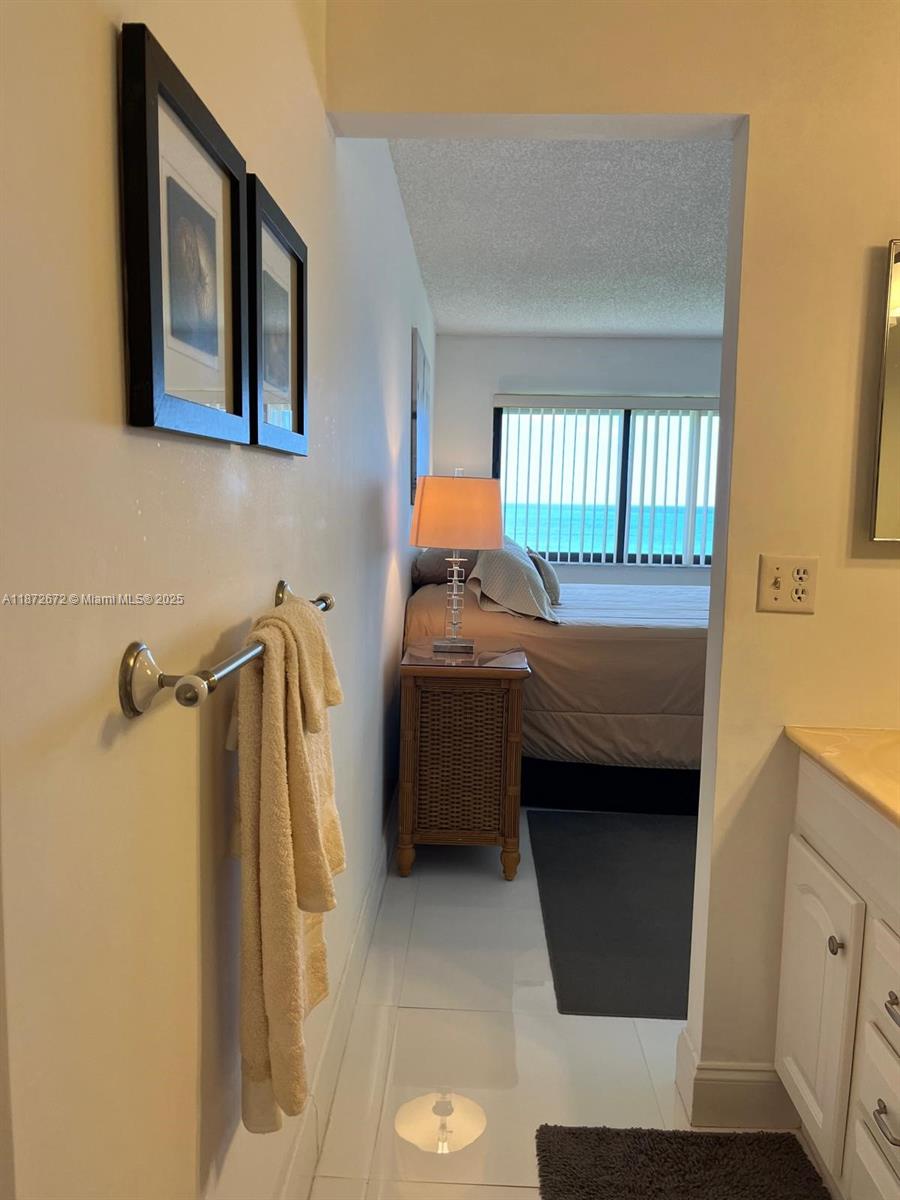 4200 North Hwy A1A, Unit 614 Fort Pierce, FL 34949 - Photo 23 of 63 a bedroom with a bed and a window