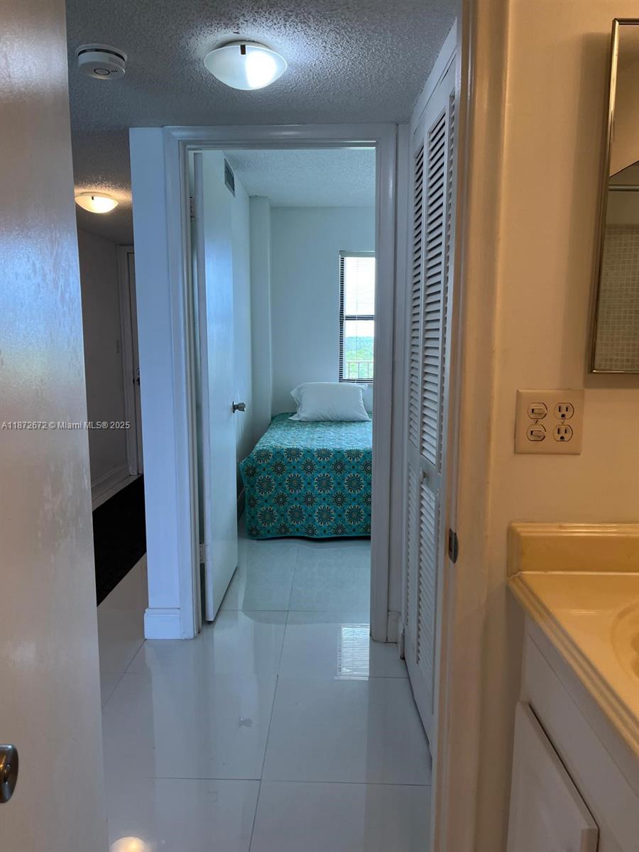 4200 North Hwy A1A, Unit 614 Fort Pierce, FL 34949 - Photo 34 of 63 a view of a bathroom from a hallway