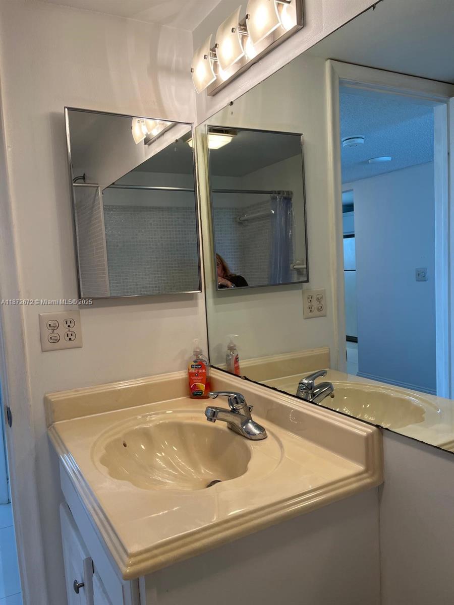 4200 North Hwy A1A, Unit 614 Fort Pierce, FL 34949 - Photo 35 of 63 a bathroom with a sink and a mirror