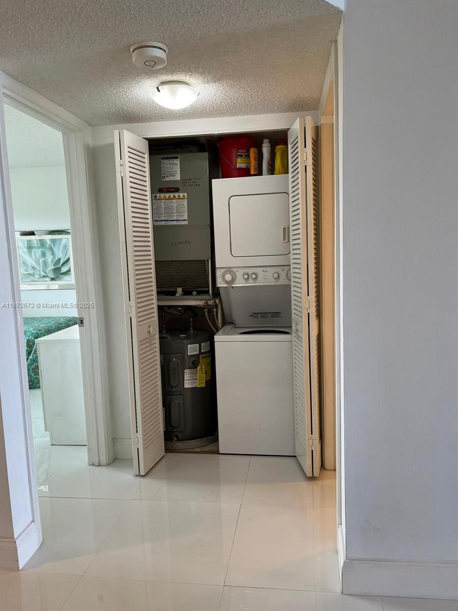 4200 North Hwy A1A, Unit 614 Fort Pierce, FL 34949 - Photo 37 of 63 a utility room with dryer and washer