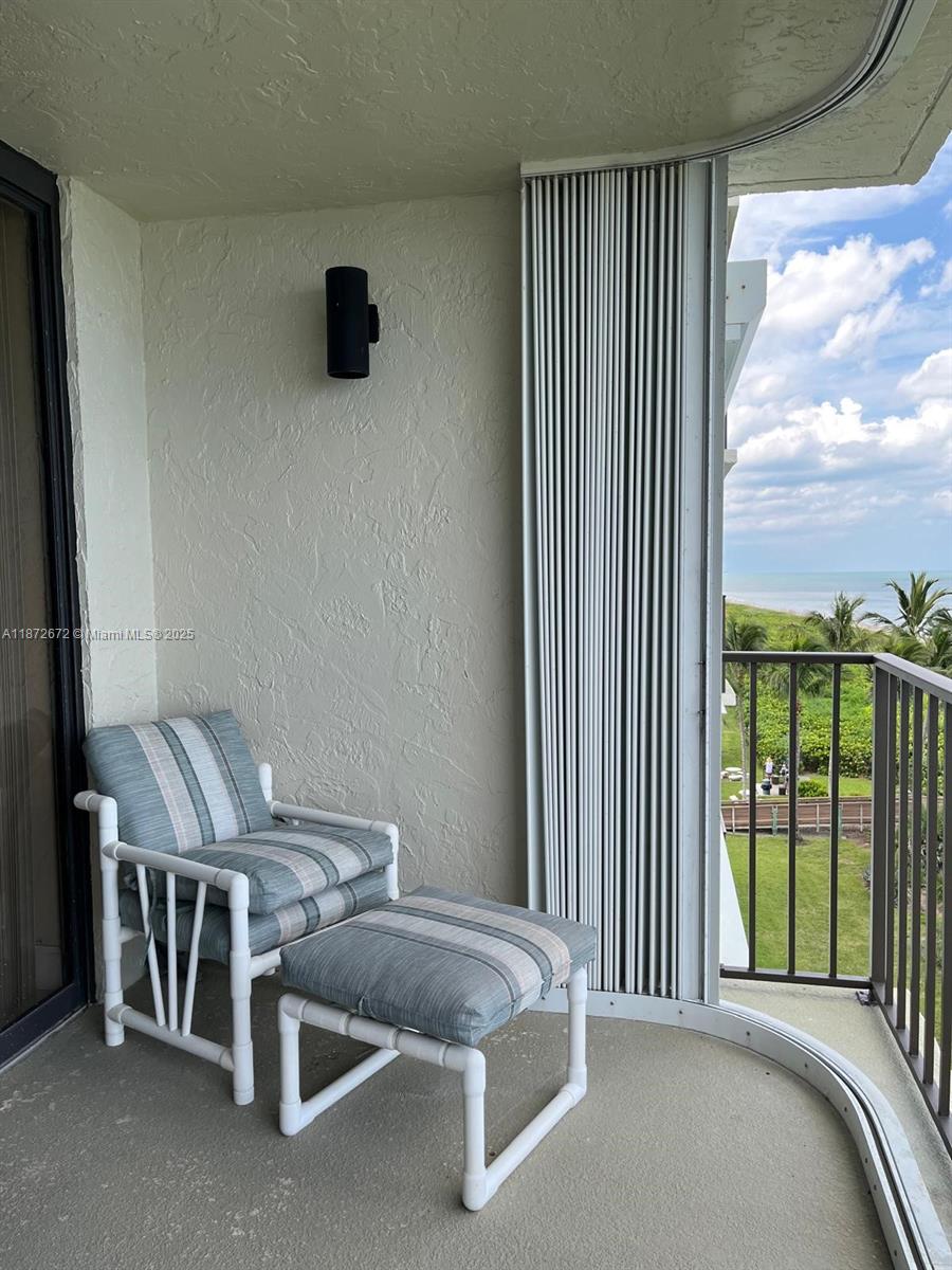 4200 North Hwy A1A, Unit 614 Fort Pierce, FL 34949 - Photo 38 of 63 a bedroom with a bed and a view of balcony
