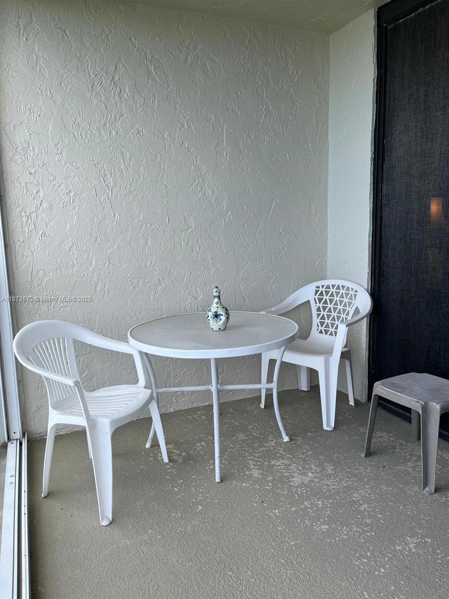 4200 North Hwy A1A, Unit 614 Fort Pierce, FL 34949 - Photo 39 of 63 a view of a room with chairs and a table