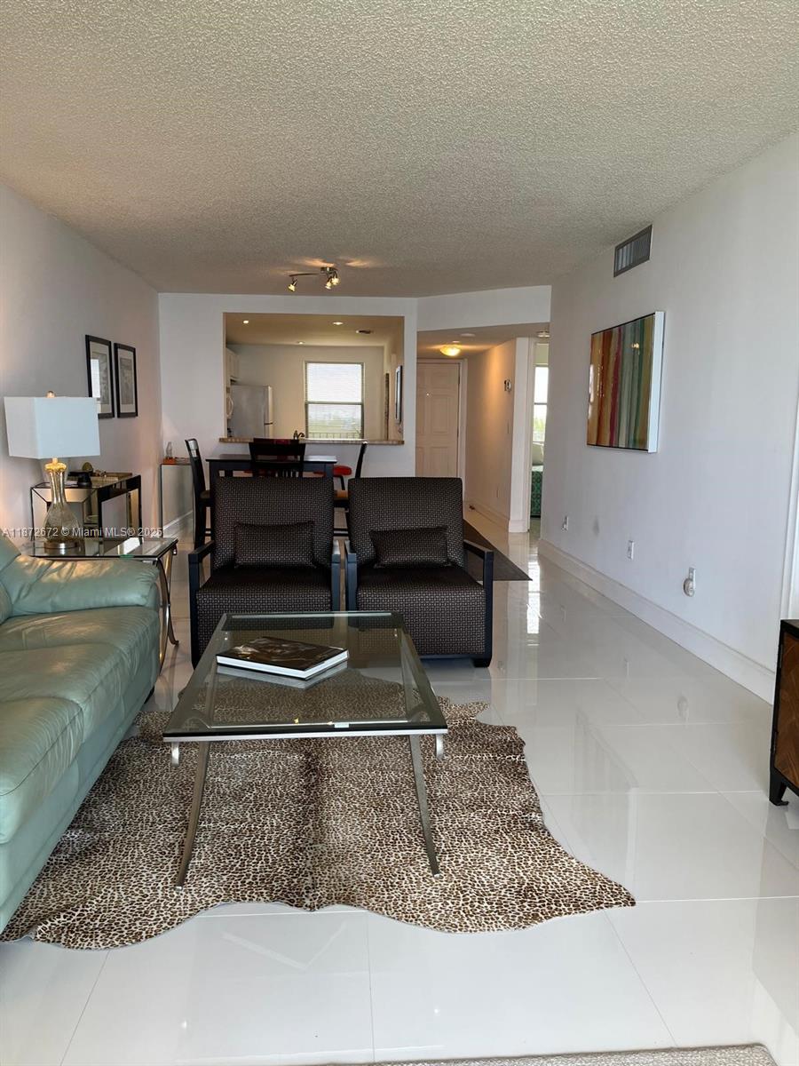 4200 North Hwy A1A, Unit 614 Fort Pierce, FL 34949 - Photo 41 of 63 a living room with furniture and a rug