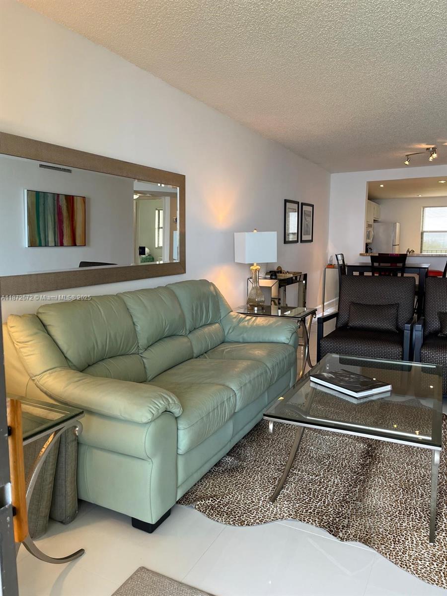 4200 North Hwy A1A, Unit 614 Fort Pierce, FL 34949 - Photo 44 of 63 a living room with furniture and a couch