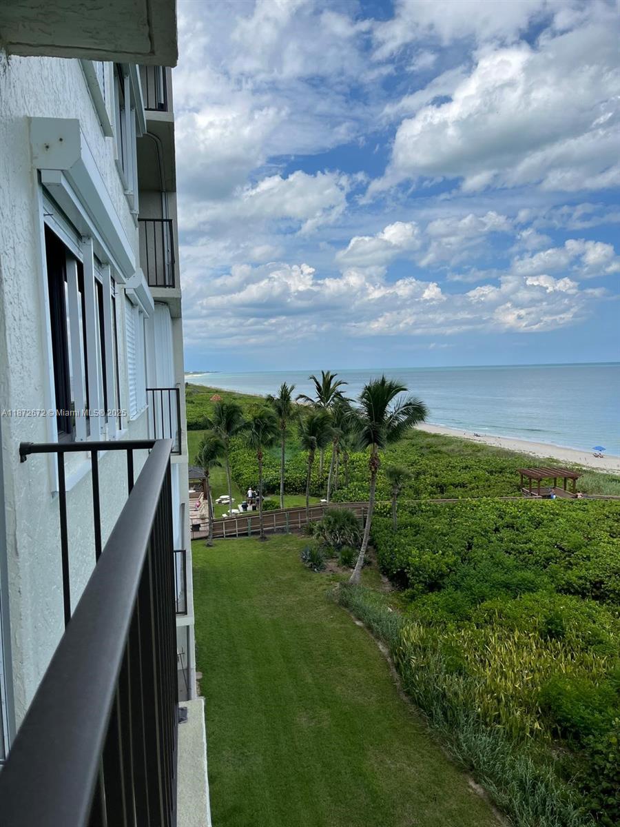 4200 North Hwy A1A, Unit 614 Fort Pierce, FL 34949 - Photo 48 of 63 a view of yard from deck having outdoor seating