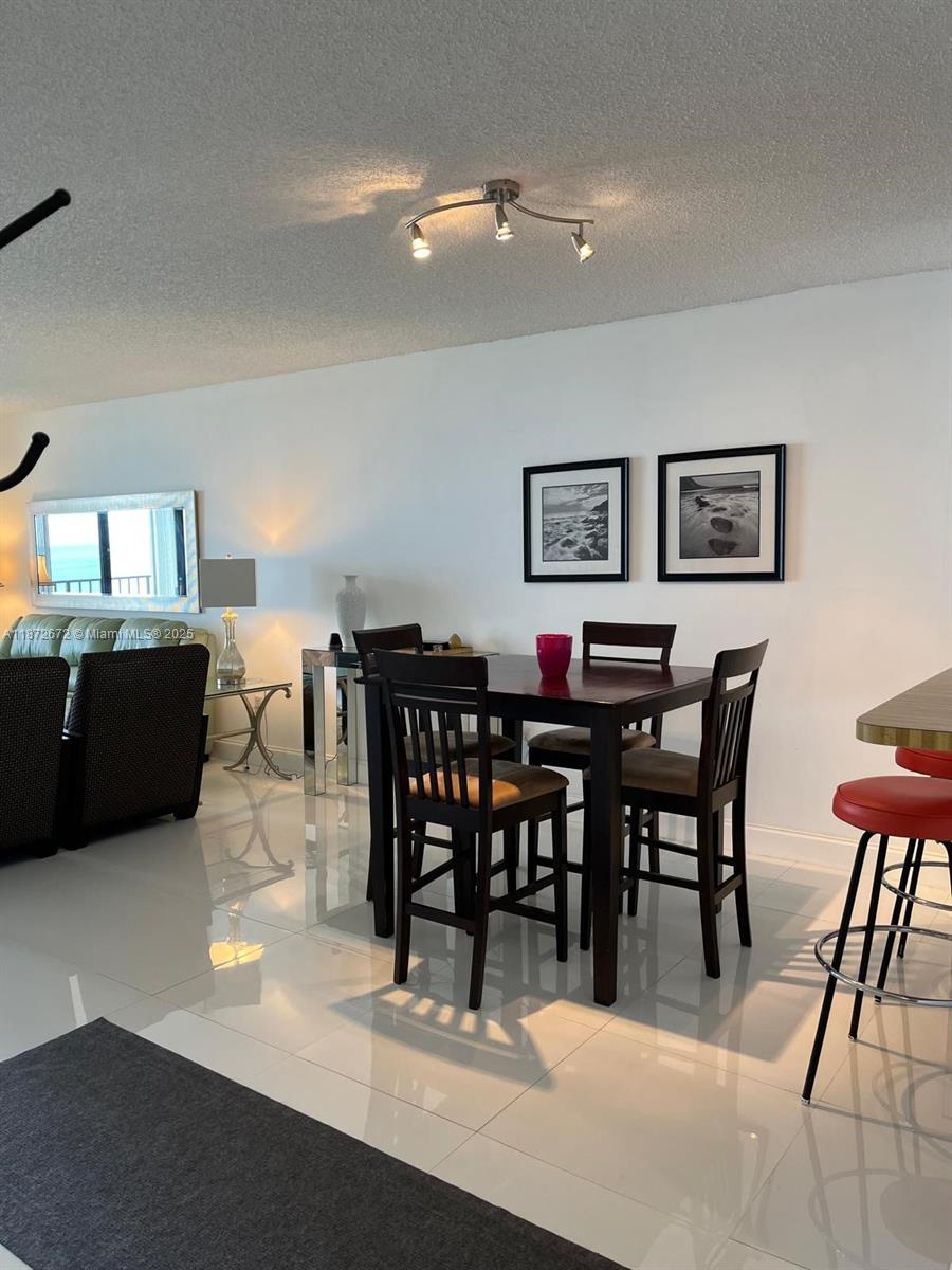 4200 North Hwy A1A, Unit 614 Fort Pierce, FL 34949 - Photo 5 of 63 a view of a dining room with furniture