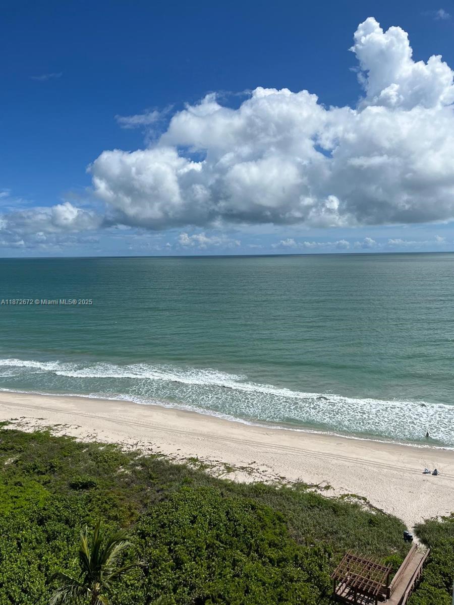 4200 North Hwy A1A, Unit 614 Fort Pierce, FL 34949 - Photo 62 of 63 a view of a lake and a yard