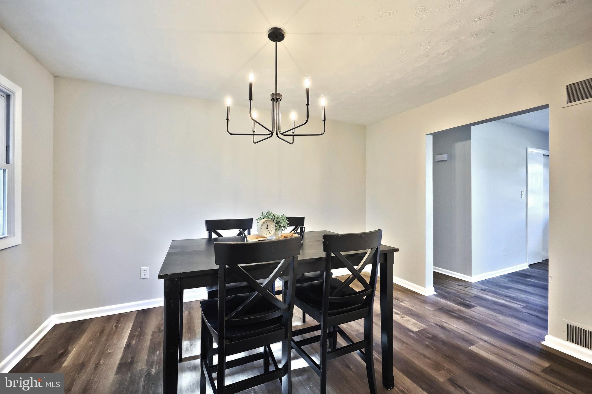 200 West Main Street Shiremanstown, PA 17011 - Photo 18 of 41 a view of a dining room with furniture and wooden floor