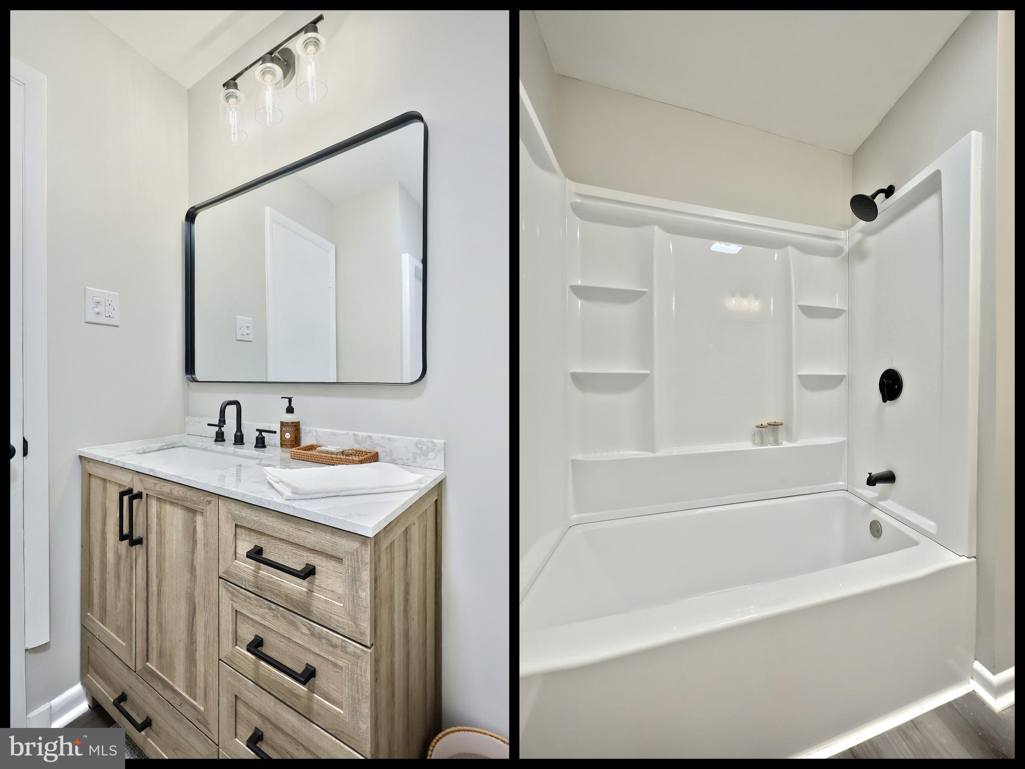 200 West Main Street Shiremanstown, PA 17011 - Photo 27 of 41 a bathroom with a bathtub a mirror a sink and vanity