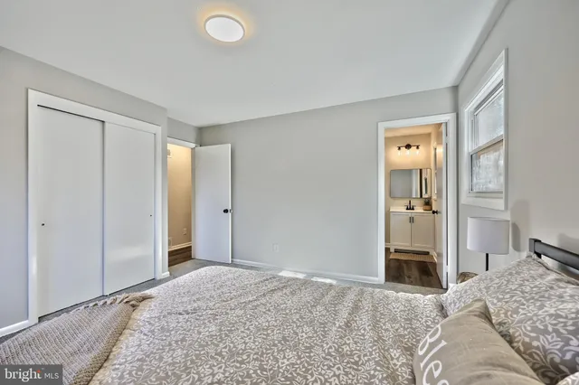 a bedroom with a bed and a dresser