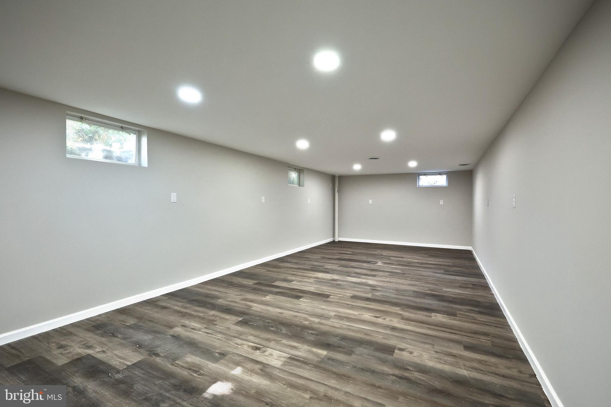 200 West Main Street Shiremanstown, PA 17011 - Photo 34 of 41 an empty room with wooden floor and windows