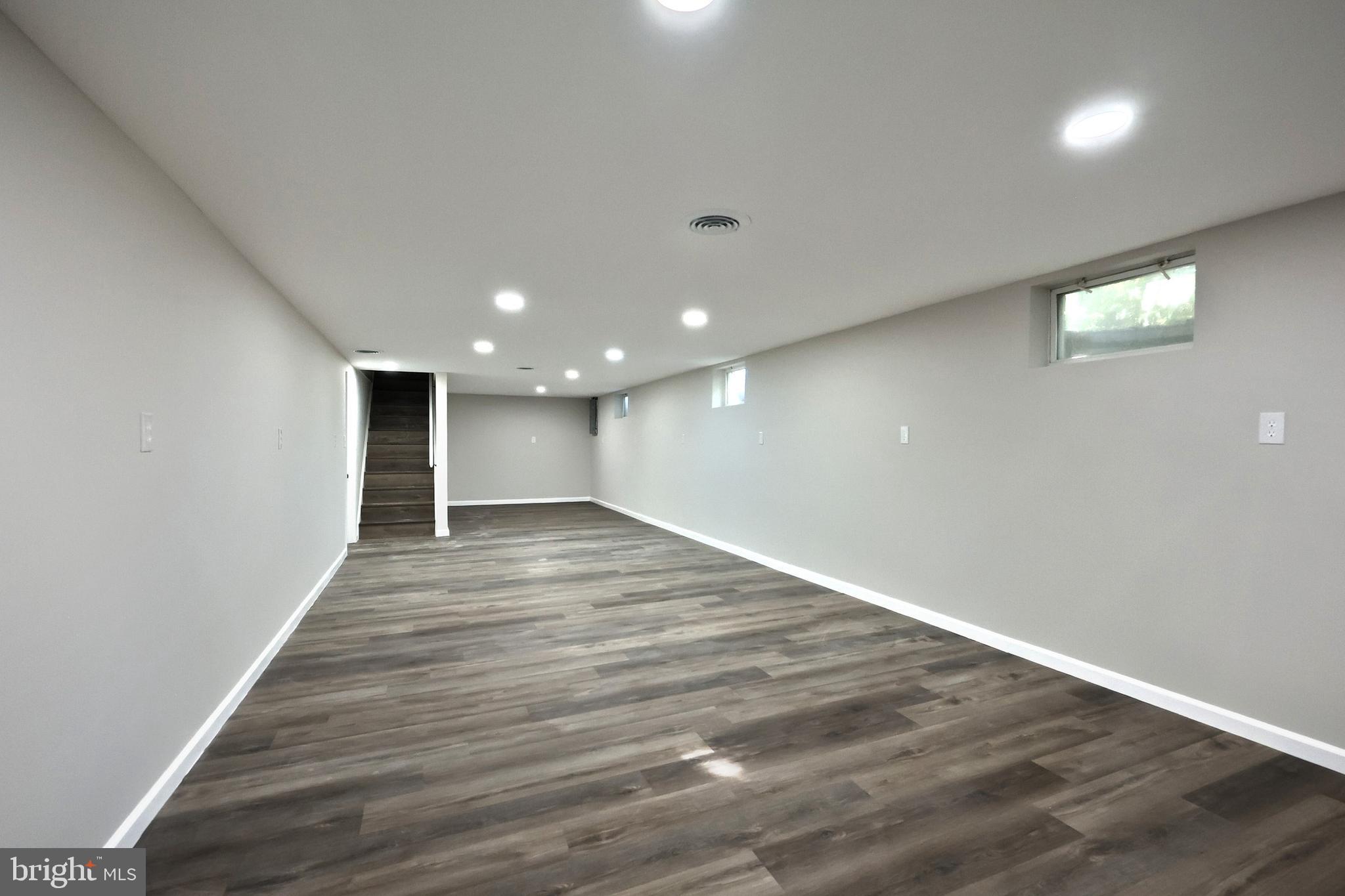 200 West Main Street Shiremanstown, PA 17011 - Photo 35 of 41 an empty room with wooden floor and windows