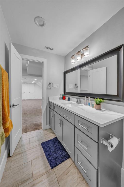 3837 Kimball Ridge Drive Dallas, TX 75233 - Photo 12 of 40 a bathroom with a double vanity sink and a mirror