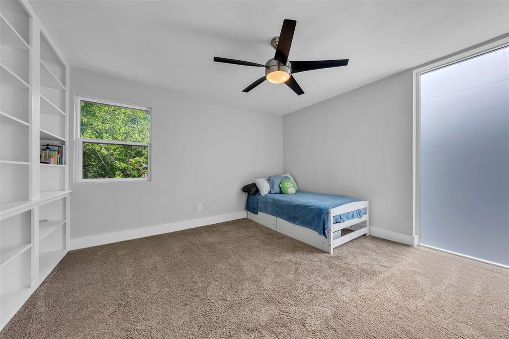 3837 Kimball Ridge Drive Dallas, TX 75233 - Photo 16 of 40 a room with window and a ceiling fan