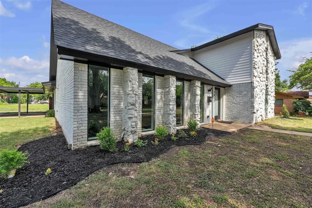 3837 Kimball Ridge Drive Dallas, TX 75233 - Photo 2 of 40 a front view of a house with garden
