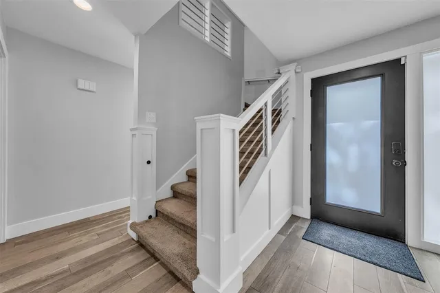 a bathroom with a stove a sink and a mirror