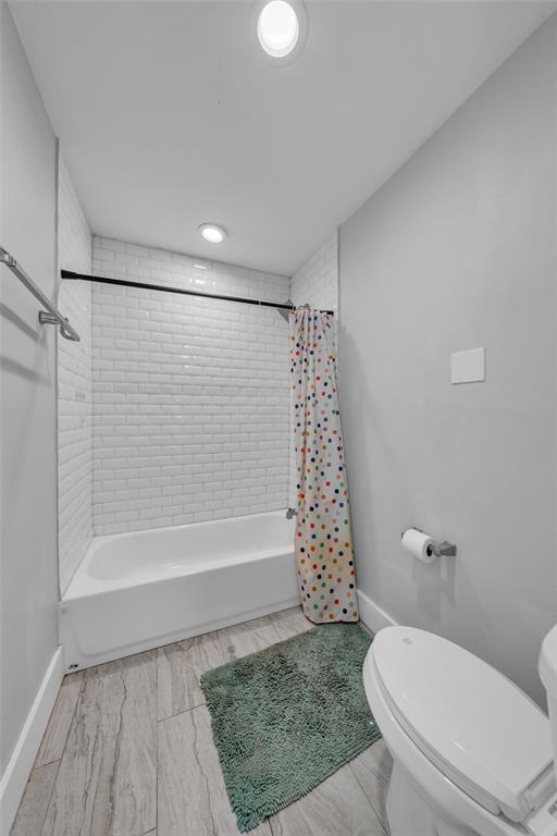 3837 Kimball Ridge Drive Dallas, TX 75233 - Photo 31 of 40 a bathroom with a toilet and a shower