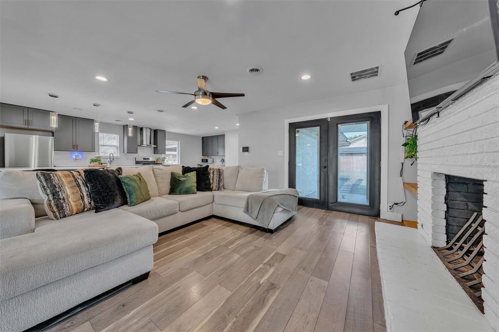 3837 Kimball Ridge Drive Dallas, TX 75233 - Photo 36 of 40 a living room with furniture and a fireplace