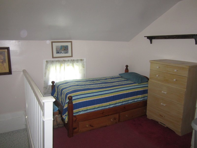 102 South Main Road Otis, MA 01253 - Photo 14 of 25 a bedroom with a bed and a window