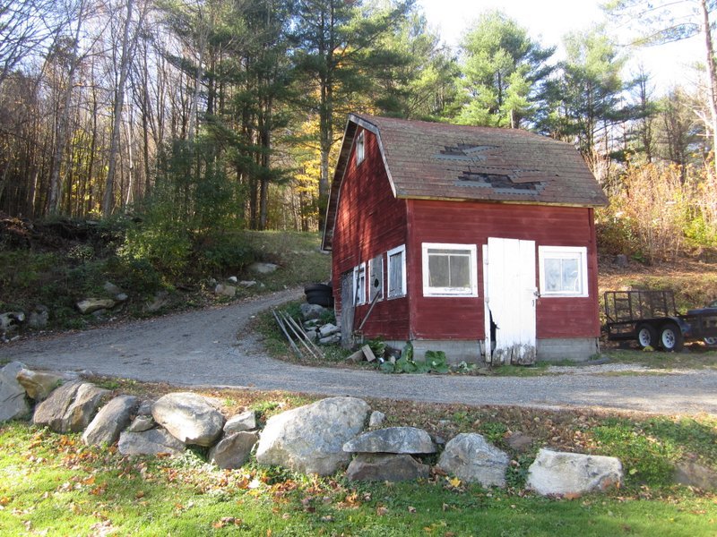 102 South Main Road Otis, MA 01253 - Photo 15 of 25 a front view of a house with garden