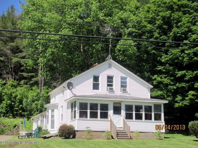 102 South Main Road Otis, MA 01253 - Photo 23 of 25 a front view of a house with a yard