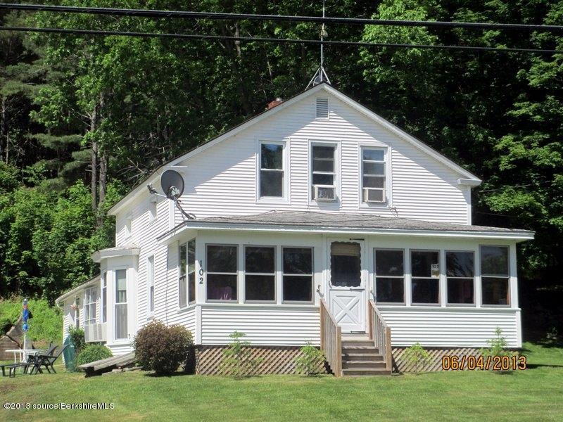 102 South Main Road Otis, MA 01253 - Photo 25 of 25 a front view of a house with a yard