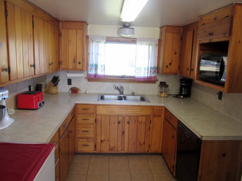 102 South Main Road Otis, MA 01253 - Photo 5 of 25 a kitchen with stainless steel appliances a sink stove and cabinets