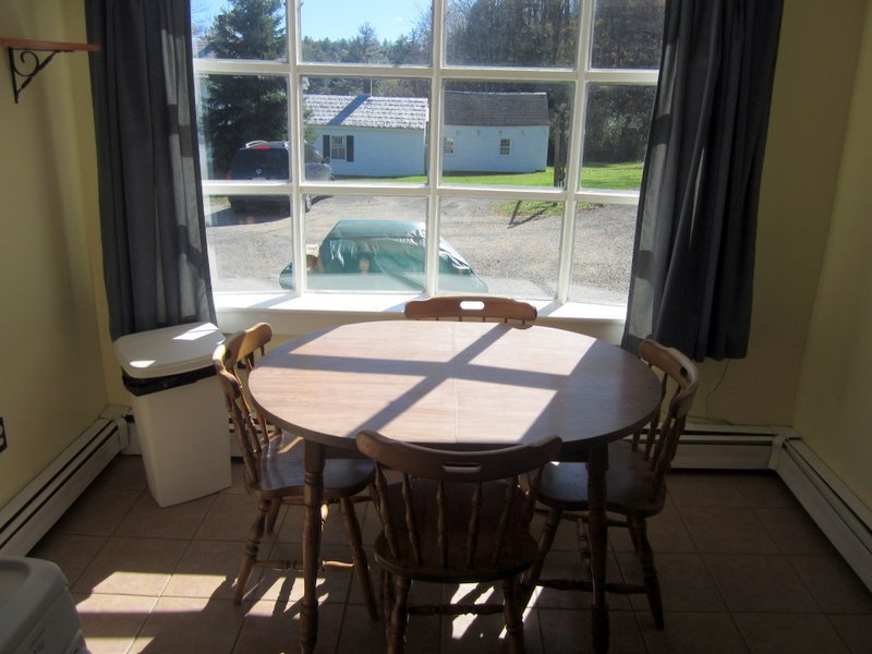 102 South Main Road Otis, MA 01253 - Photo 7 of 25 a view of a dining room with furniture and wooden floor