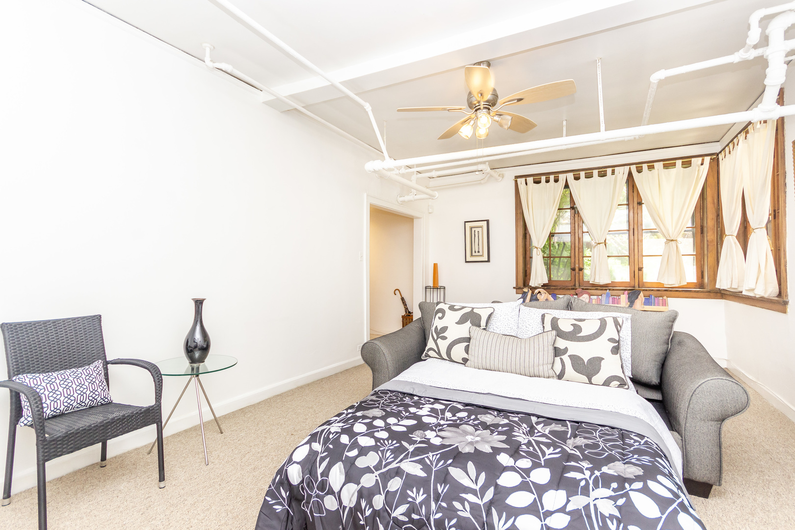 1360 East Madison Park, Unit B Chicago, IL 60615 - Photo 13 of 19 a bedroom with a large bed and wooden floor