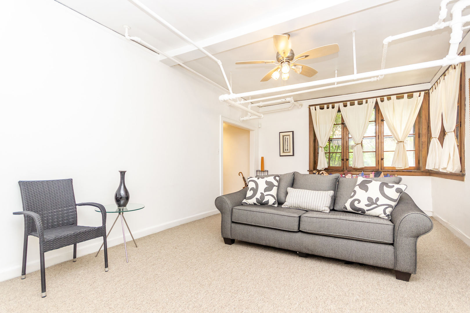 1360 East Madison Park, Unit B Chicago, IL 60615 - Photo 15 of 19 a living room with furniture and a large window