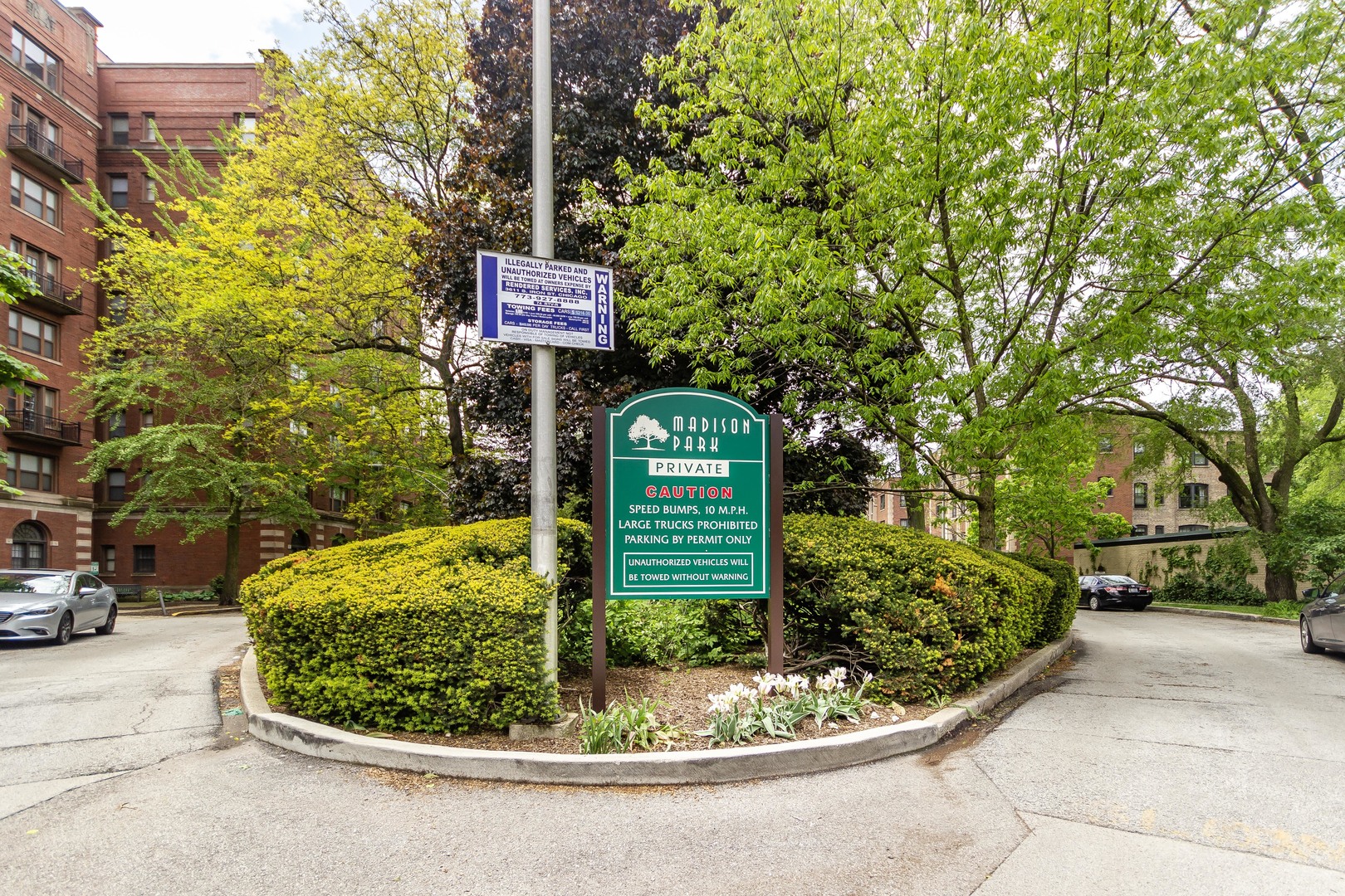 1360 East Madison Park, Unit B Chicago, IL 60615 - Photo 5 of 19 a sign that is sitting on a sidewalk