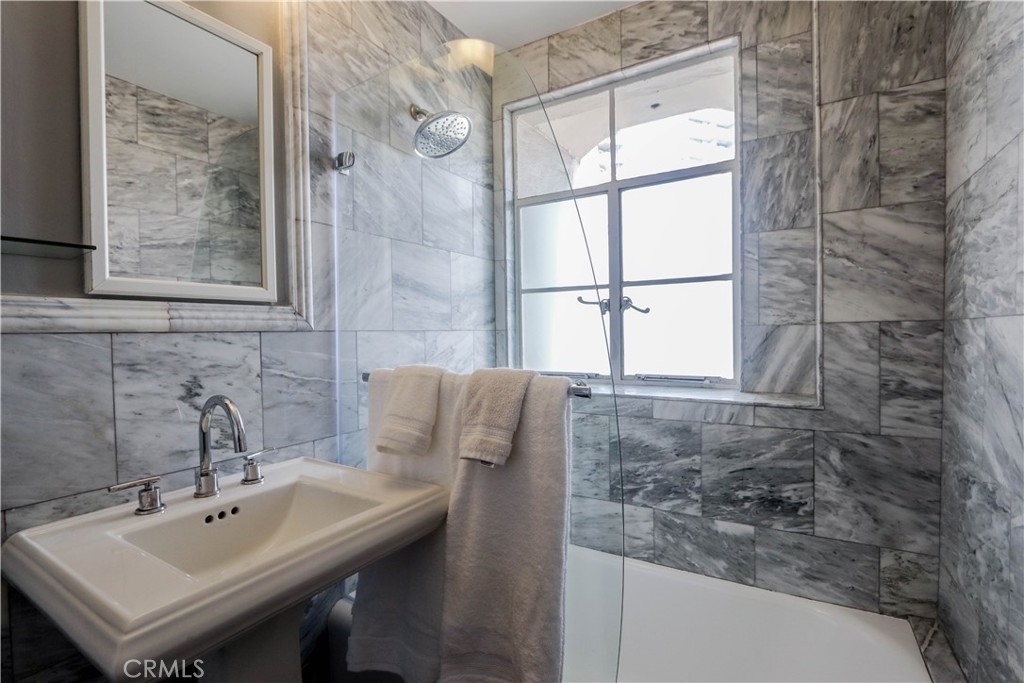 800 East Ocean Boulevard, Unit 1404 Long Beach, CA 90802 - Photo 12 of 25 a bathroom with a sink and mirror