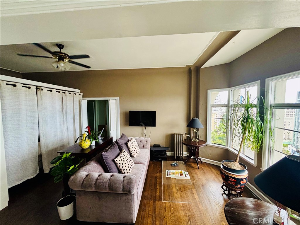 800 East Ocean Boulevard, Unit 1404 Long Beach, CA 90802 - Photo 3 of 25 a living room with furniture floor to ceiling window and a flat screen tv