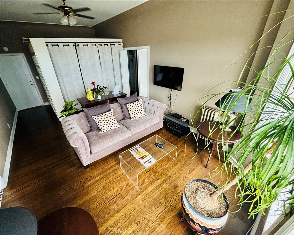 800 East Ocean Boulevard, Unit 1404 Long Beach, CA 90802 - Photo 4 of 25 a living room with furniture and a flat screen tv