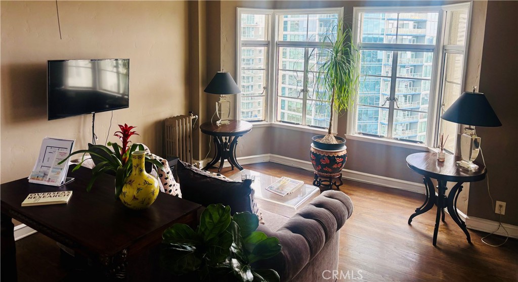 800 East Ocean Boulevard, Unit 1404 Long Beach, CA 90802 - Photo 6 of 25 a living room with furniture and a flat screen tv