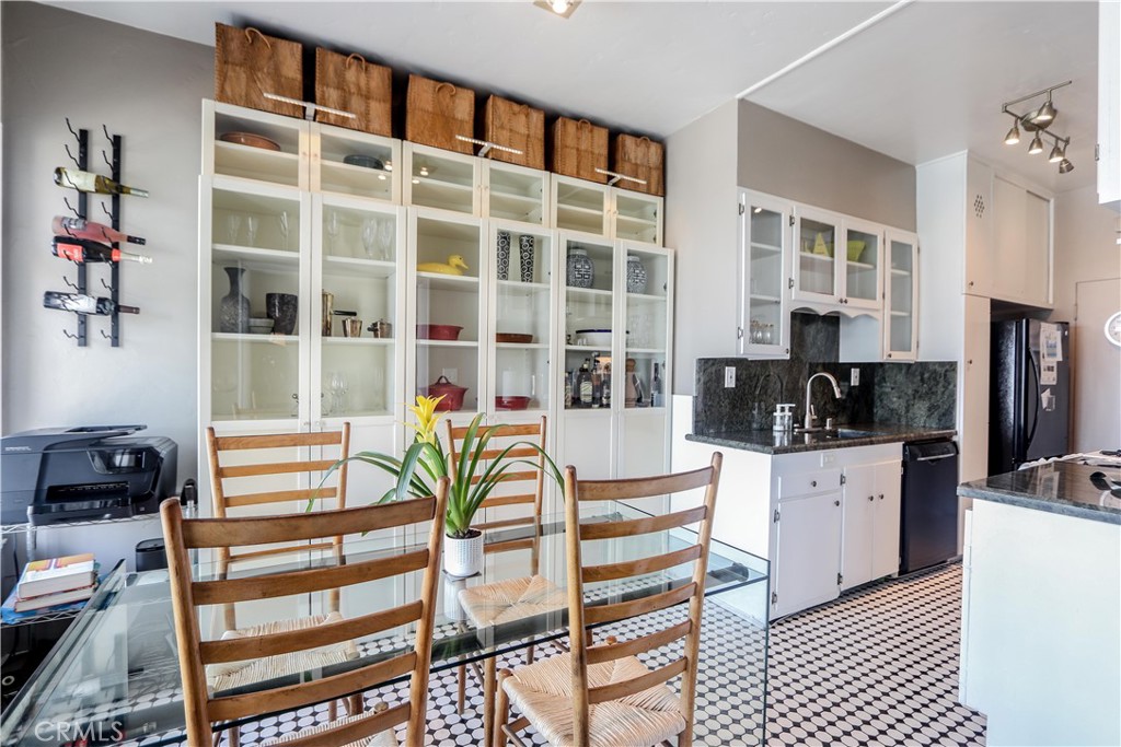 800 East Ocean Boulevard, Unit 1404 Long Beach, CA 90802 - Photo 8 of 25 a view of a dining room with furniture and chandelier